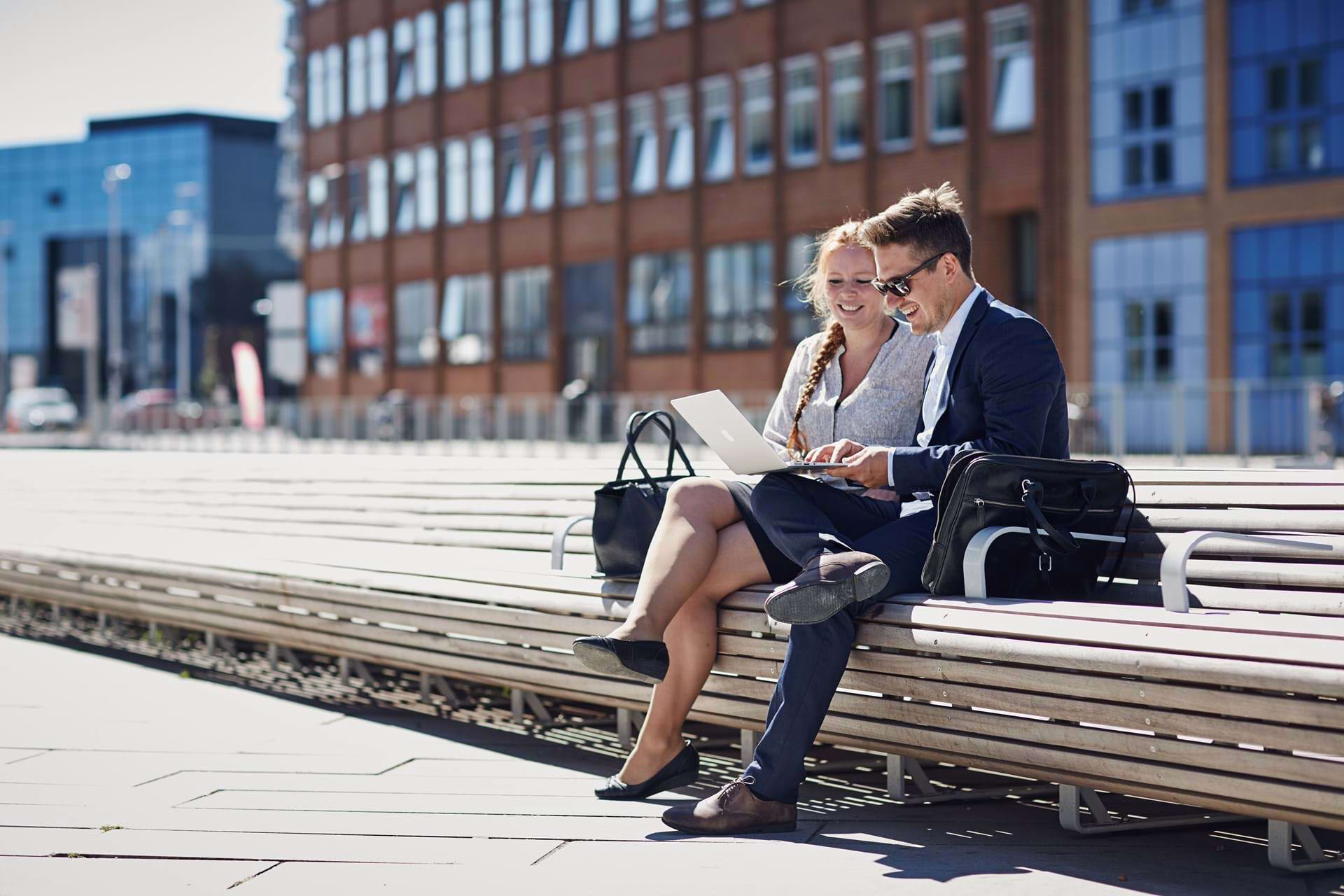 Two persons working at a bench in Aarhus